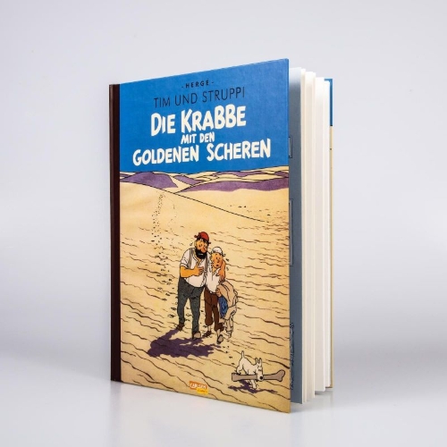 Buchcover und Innenansicht für das Buch: TINTIN: LE CRABE AUX PINCES D'OR                           