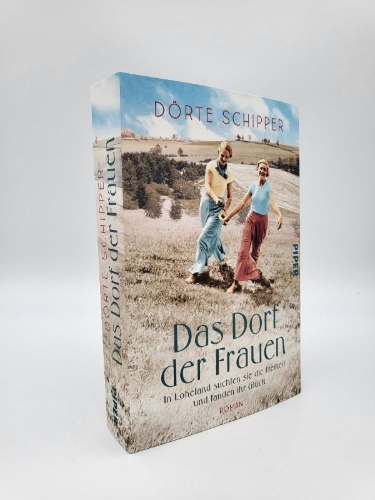 Buchcover und Innenansicht für das Buch: Das Dorf der Frauen